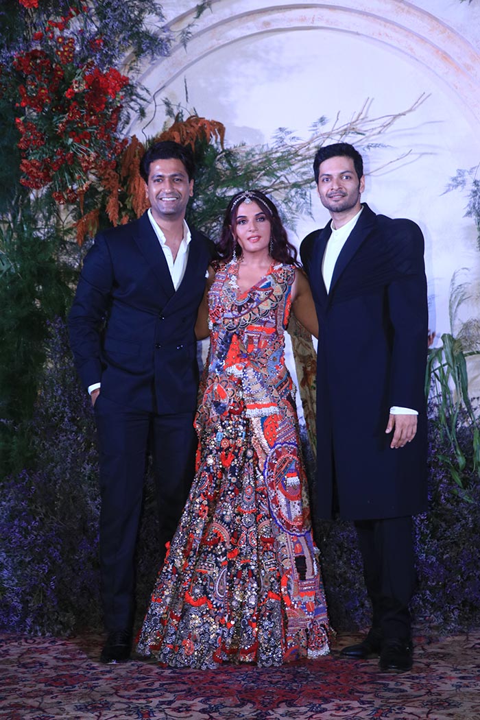 Vicky Kaushal posed with the couple.