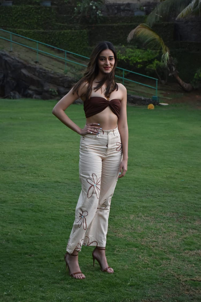 Ananya Panday paired a brown off shoulder top with a printed pants.