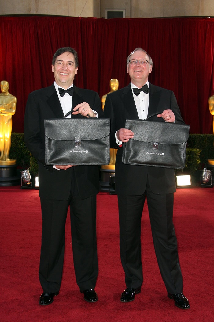 Rick Ross and Brad Oltmann(R) of Price Waterhouse Cooper arrive at the 82nd Academy Awards at the Kodak Theater in Hollywood, California on March 07, 2010. (Photo: AFP)