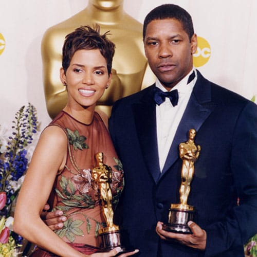 The Best Actress of 2002, Halle Berry and Best Actor Denzel Washington posed together. Washington got the award for his performance in <I>Training Day</i>.