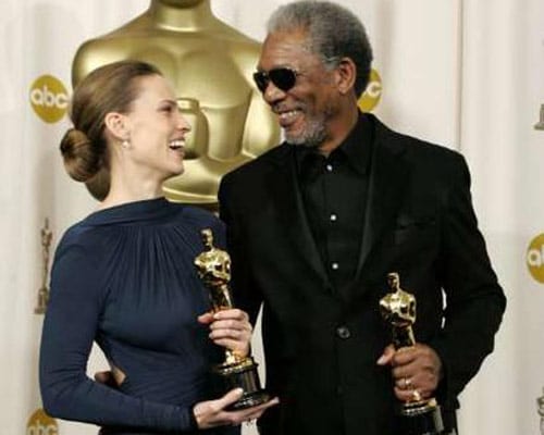 Hilary Swank and Morgan Freeman, winners of the Best Actress and Best Supporting Actor awards respectively, smile with their trophies. They won these awards for <I>Million Dollar Baby</i> in 2005.