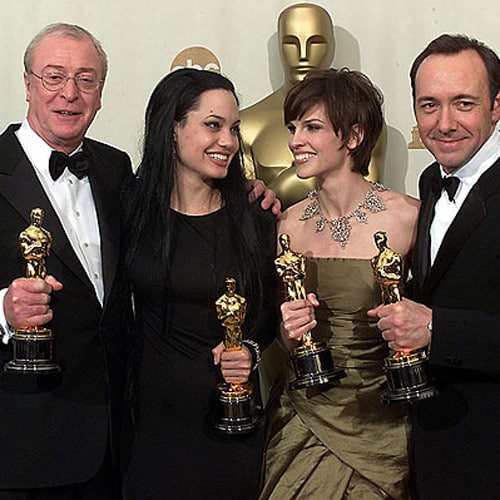 Michael Caine (Best Supporting Actor, <I>Cider House Rules</i>), Angelina Jolie, Hilary Swank (Best Actress, <I>Boys Don't Cry</i>) and Kevin Spacey (Best Actor, <I>American Beauty</i>) pose with their trophies at the Oscars 2000.