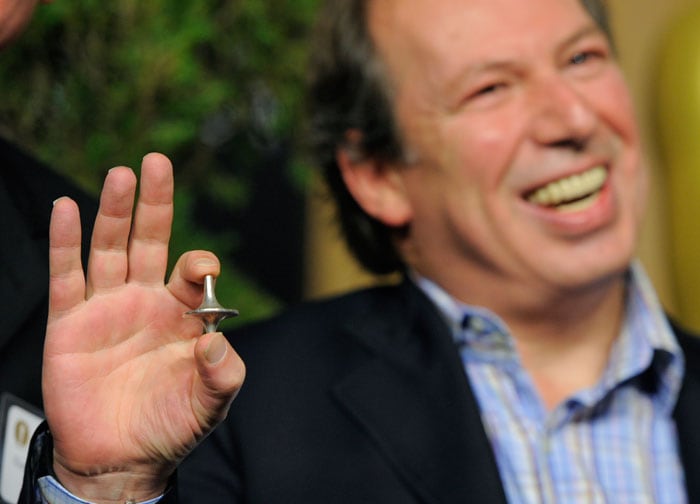 Hans Zimmer, nominated for Original Score for "Inception," holds up a spin top used in the film. <br />
<a href="http://movies.ndtv.com/oscar11/default.aspx"> <img src=/photos/entertainment/oscars-2011-nominees-luncheon-9115/amp/1/"http:/drop.ndtv.com/albums/uploadedpics/small/700_50_oscar_634330423803629872.jpg" border="0"/>
</a>