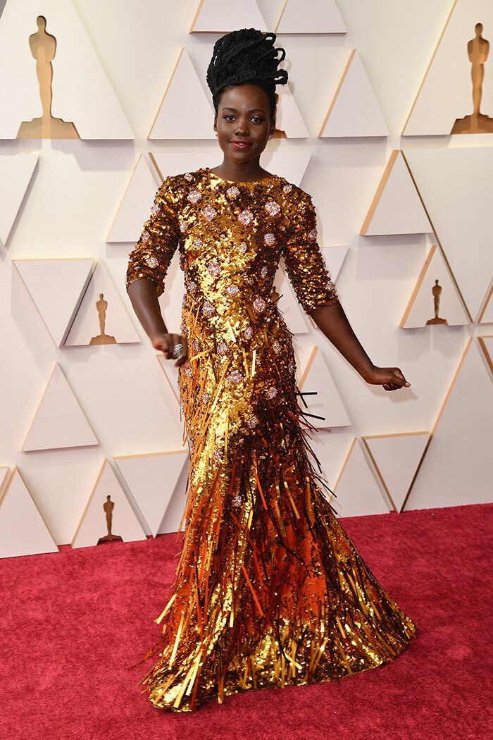 Lupita Nyong'o was the golden girl in a Prada gown on the red carpet