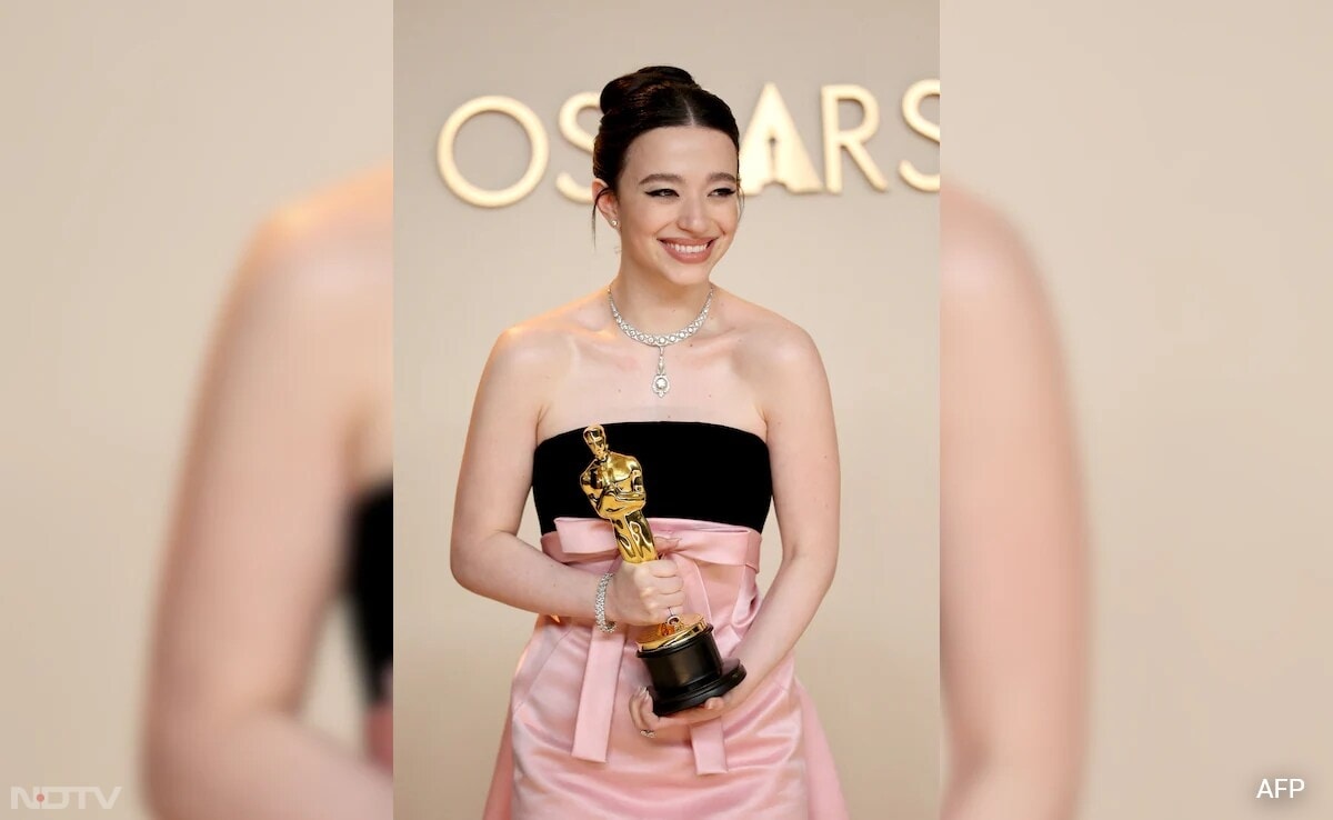 Mikey Madison wore a black and pink satin gown by Dior, and jewels from Tiffany and Co. (Image Courtesy: AFP)