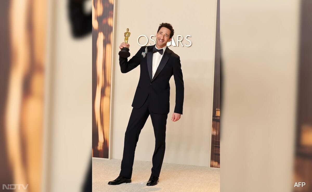 Adrien Brody was suited up in a midnight blue tuxedo by Giorgio Armani. (Image Courtesy: AFP)