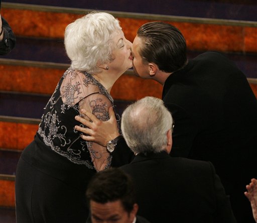 Thelma Schoonmaker is congratulated by Leonardo DiCaprio after winning the Oscar for achievement in film editing for her work on The Departed at the 79th Academy Awards