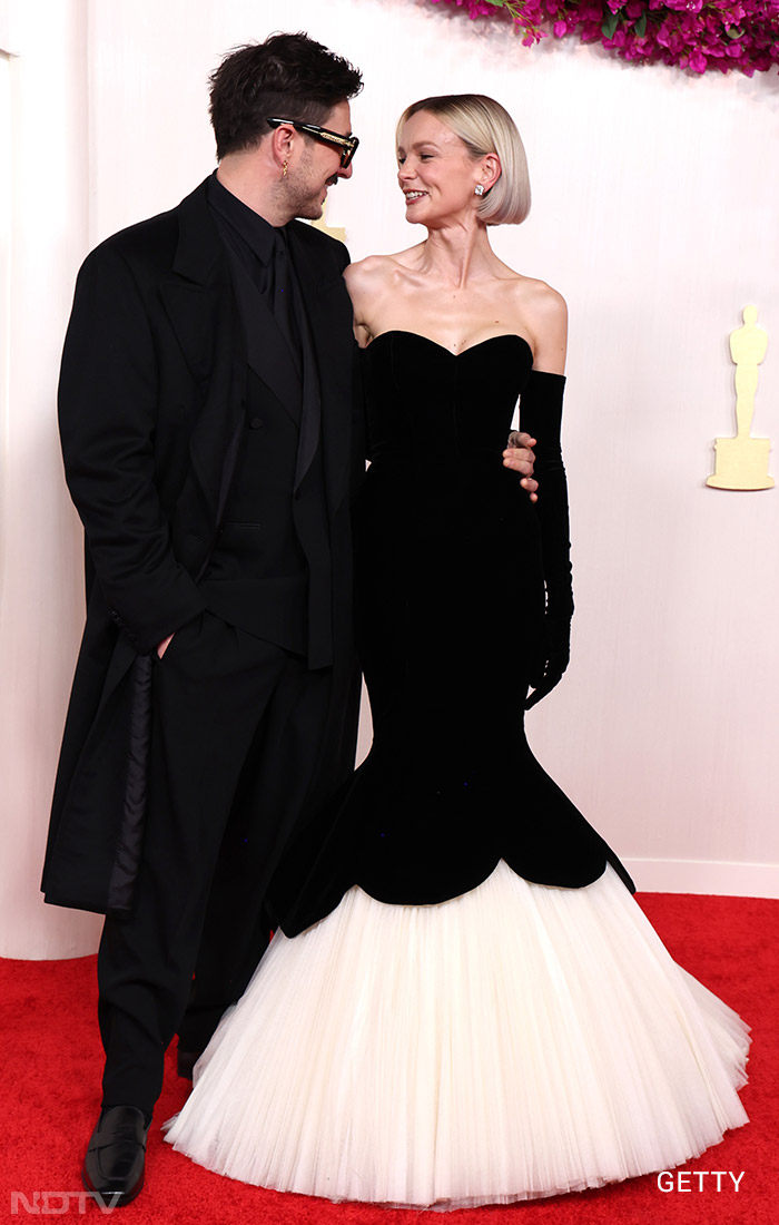 Custom Balenciaga Couture was Carey Mulligan's pick. She posed with Marcus Mumford. (Image courtesy: Getty)