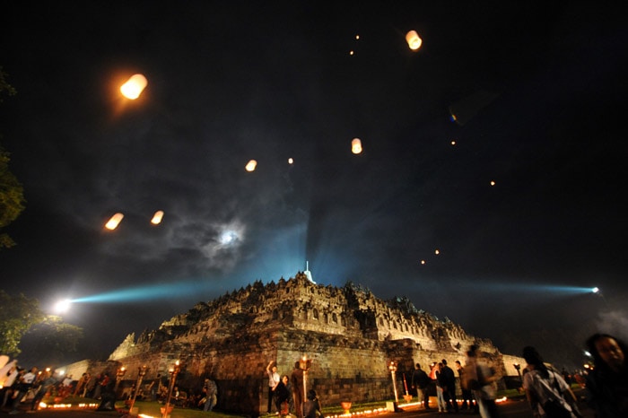 Indonesian monks hold prayers during the Vesak festival at the Borobudur temple in Magelang on May 28, 2010. Vesak day is a Buddhist holiday commemorating the birth, enlightement and death of the historical Gautama Buddha, in Indonesia is held on May 28. (Photo: AFP)