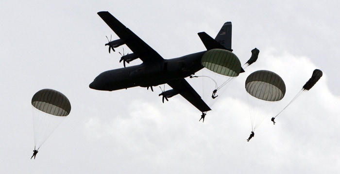 Parachutists jump on June 5, 2010 near Sainte-Mere-Eglise, during the D-Day celebrations to mark the 66th anniversary of the June 6, 1944 allied landings in France. (Photo: AFP)