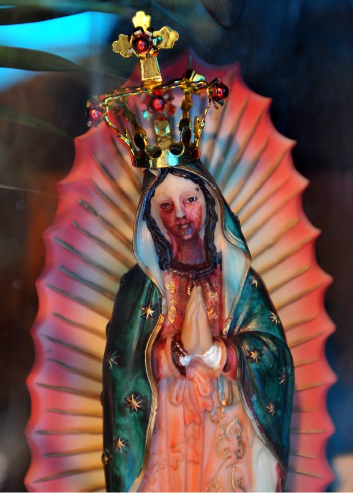 A plaster image of the Virgin of Guadalupe which allegedly cries tears of blood, in Guatemala City, June 3, 2010. Guatemalan Juan Carlos Ramos, 14, owner of the image, says that he also saw in his dreams the Virgin, who predicted the eruption of the Pacaya volcano and the passage of the tropical storm Agatha. (Photo: AFP)