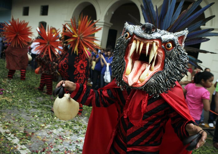 A man wearing a devils mask dances during the traditional Corpus Christi celebration in La Villa, Panama, on Thursday, June 3, 2010. Corpus Christi is celebrated by Roman Catholics and other Christians to proclaim the truth of the 'transubstantiation' or change of bread and wine into the actual body of Christ during Mass. (Photo: AP)