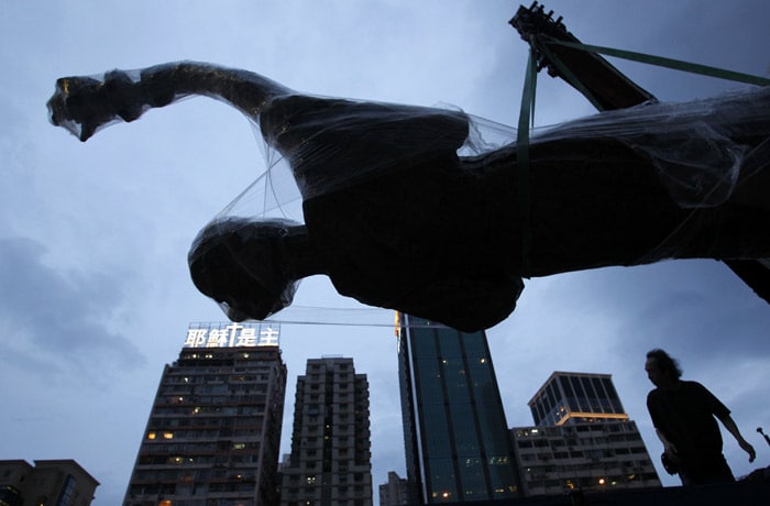 A worker from Hong Kong Alliance in Support of Patriotic Democratic Movements in China loads down the 'Goddess of Democracy' statue as it is returned by police at a park in Hong Kong on Tuesday, June 1, 2010. Hong Kong police on Tuesday agreed to return a statue dedicated to victims of the 1989 Tiananmen Square crackdown that they had confiscated, in a dispute that has sparked worries about freedom of speech in this semiautonomous Chinese territory. A senior police official said the police agreed to release the 21-foot 'Goddess of Democracy' statue and a large carved tablet depicting the June 1989 crackdown in Beijing as a goodwill gesture.(Photo: AP)A worker from Hong Kong Alliance in Support of Patriotic Democratic Movements in China loads down the 'Goddess of Democracy' statue as it is returned by police at a park in Hong Kong on Tuesday, June 1, 2010. Hong Kong police on Tuesday agreed to return a statue dedicated to victims of the 1989 Tiananmen Square crackdown that they had confiscated, in a dispute that has sparked worries about freedom of speech in this semiautonomous Chinese territory. A senior police official said the police agreed to release the 21-foot 'Goddess of Democracy' statue and a large carved tablet depicting the June 1989 crackdown in Beijing as a goodwill gesture.(Photo: AP)