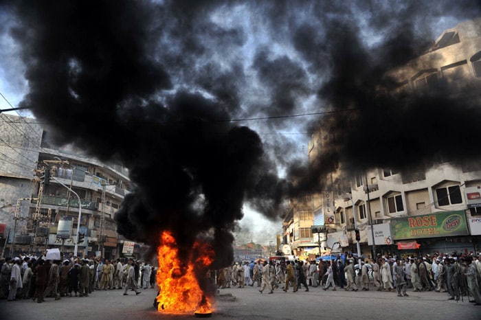 Pakistani demonstrators burn tyres during a protest against Israel, after its military move against a relief aid fleet on its way to the Gaza Strip, in Peshawar on May 31, 2010. Pakistan condemned an Israeli commando attack on a flotilla of aid ships bound for the Gaza Strip, describing the killings of up to 19 activists as "brutal and inhuman." (Photo: AFP)