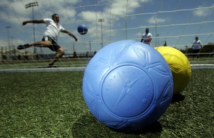 One World Futbol Project soccer balls are shown in Oakland, Calif., on Tuesday, July 6, 2010. Tim Jahnigen put his mind to inventing a ball that would never wear out, one he insists is the most durable of any "futbol" out there, made of closed cell foam and similar material to those popular rubber Crocs sandals. (Photo: AP)