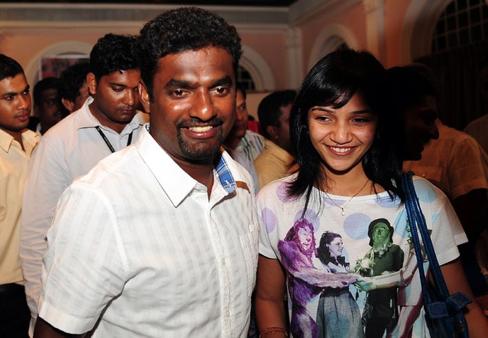 Sri Lankan cricketer Muttiah Muralitharan (L) and his wife Madhimalar (R) attend a press conference in Colombo on July 8, 2010. Sri Lanka's world bowling record holder Muttiah Muralitharan said on July 7 he was retiring from Test cricket because he had nothing left to strive for. (Photo: AFP)