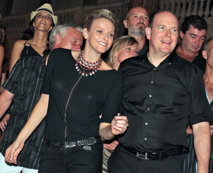 Prince Albert II of Monaco (R) and his fiance Charlene Wittstock of South Africa attend concerts of Iggy Pop and the Stooges and ZZ Top on July 5, 2010 on the Prince's Palace square in Monaco. (Photo: AFP)