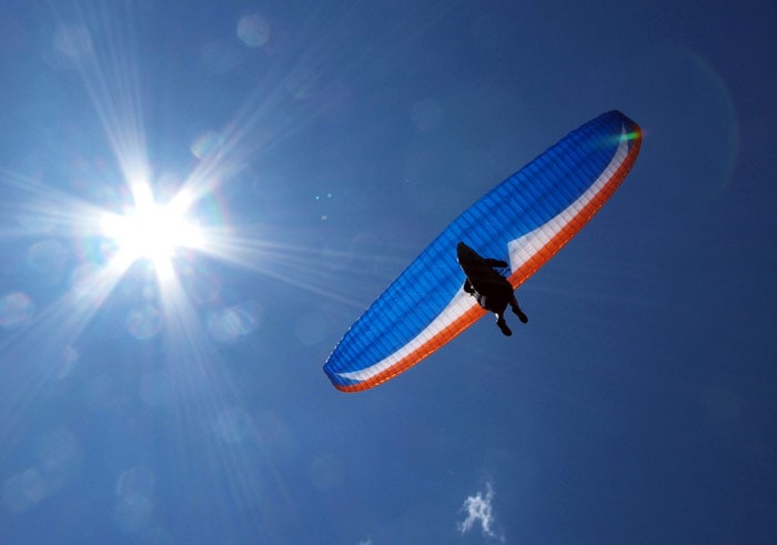 A paraglider flies near Chopok mountain in the Low Tatra mountains on July 10, 2010 in Jasna. The ideal weather attracted many pilots and visitors alike to spend weekend in the famous Slovakian resort of Jasna. (Photo: AFP)