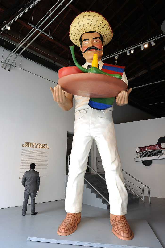 "La Salsa Man" is on display at the press preview of "Dennis Hopper: Double Standard," the first US comprehensive museum survey of the works of the actor/artist/director, on July 9, 2010 at the Museum of Contemporary Art (MOCA) in Los Angeles. Best known for his work in cinema, including the 1969 film classic "Easy Rider, the show traces the evolution of Hopper's artistic output in a variety of medium and features more than 200 works spanning his prolific 60-year career including photography, painting, sculpture, film, installations and found art. (Photo: AFP)