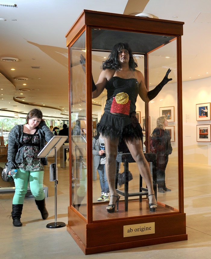 Constantina Bush, an alter-ego of male Aboriginal performer Kamahi King, poses in a museum display case in 'Jacky Jacky in the Box' at a preview of a new Aboriginal exhibition titled '20 Years: Bold. Black. Brilliant.' at the Melbourne Museum on July 7, 2010. Ilbijerri Theatre Company and the Museum are presenting 'Jacky Jacky in the Box', a performance art installation in which an Aboriginal actor is exhibited in the case, challenging audiences to reconsider their perceptions of Indigenous Australia as an anthropological curiosity. (Photo: AFP)