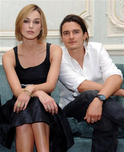 British actors Keira Knightley and Orlando Bloom pose for photographs after holding a press conference to promote their new film, Pirates Of The Carribean: Dead Man's Chest, at Claridges Hotel, in central London.