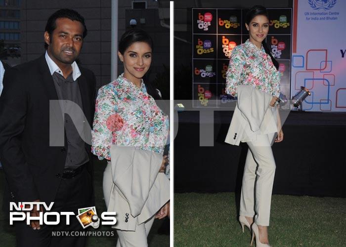 Chic Asin stepped out for the 2nd Annual Young Changemakers Conclave 2012. Asin, who was recently seen in hit comedy <i>Housefull 2</i> wore a floral shirt from Zara with beige pants and pumps. <br><br>Seen here with tennis player Leander Paes