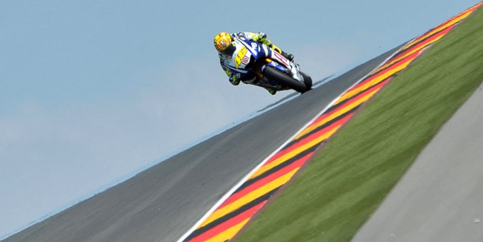 Nine-time world champion Valentino Rossi of Italy (Fiat Yamaha Team) steers his bike during the training of of the Grand Prix of Germany at Sachsenring Circuit on July 16, 2010 in Hohenstein-Ernstthal, eastern Germany. The 31-year-old Italian has been given the green light to make a return to MotoGP on July 18, just 40 days after suffering a double fracture of his right leg. (Photo: AFP)