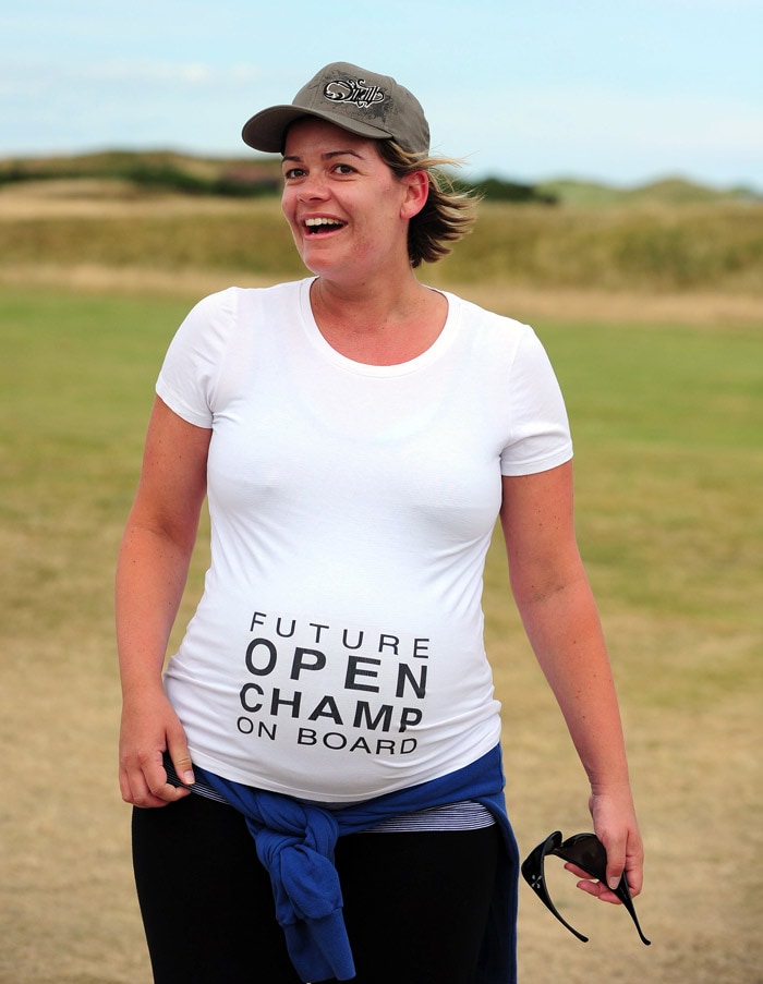 Optimistic pregnant spectator watching the play on day four of the British Open Golf Championship at St Andrews in Scotland, on July 18, 2010. (Photo: AFP)