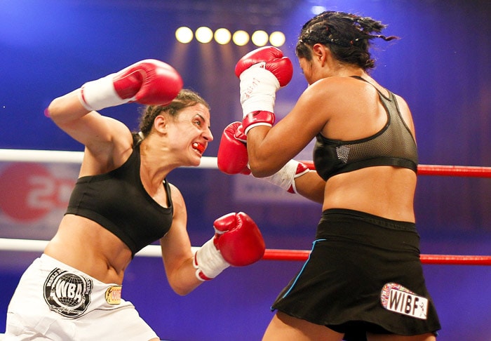 German boxer Susianna Kentikian, left, fights against Mexican boxer Arely Mucino in the WBA and WIBF and WBO World Championship flyweight fight in Schwerin, northern Germany, on Saturday, July 17, 2010. (Photo: AP)