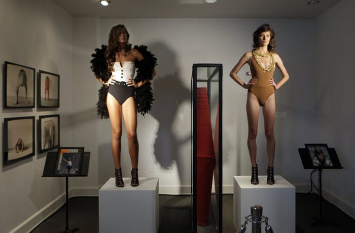 Models pose on a cube among art work at the Bass Museum of Art before the Red Carter show during the Mercedes-Benz Fashion Week Swim 2011 in Miami Beach, Fla. on Sunday, July 18, 2010. (Photo: AP)