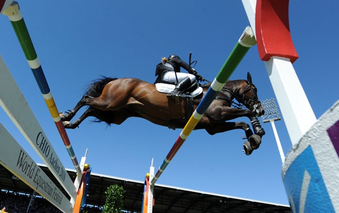 German Janne-Friederike Meyer jumps during the Grand Prix Jumping Competition at the CHIO World Equestrian Festival 2010 in Aachen, western Germany, on July 18, 2010. (Photo: AFP)