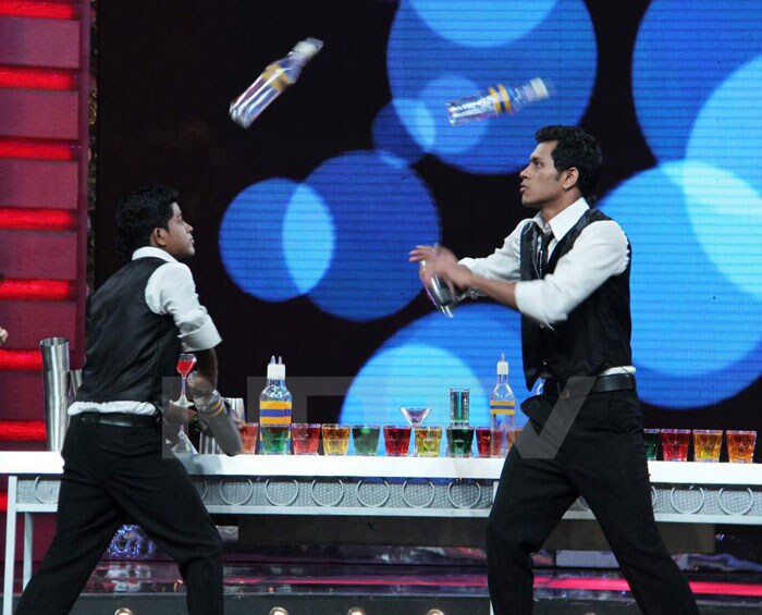 Pankaj and Sachin juggling with the bottles.