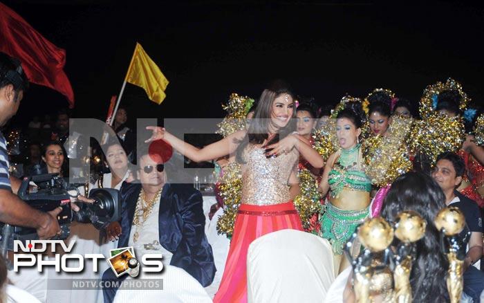 Priyanka Chopra performs while Bappi Lahiri looks on.