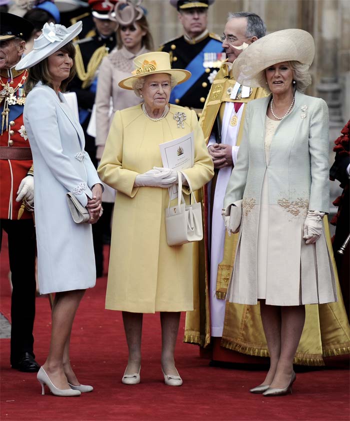 The Queen is flanked by mother of the bride Carole Middleton, left, and Camilla, Duchess of Cornwall, outside of Westminster Abbey.