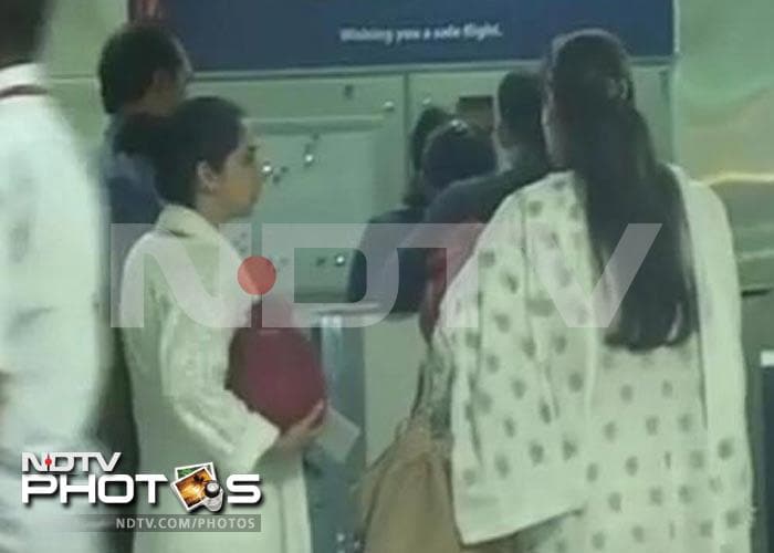 Dimple and Rinke at the airport. Elder daughter Twinkle, who is expecting her second child with husband Akshay Kumar, has been advised rest. She was also absent from the funeral procession and was last spotted at her father's <i>chautha</i> on Saturday (July 21). <br><br>Coming Up: Anju Mahendroo at Rajesh Khanna's <i>chautha</i>.