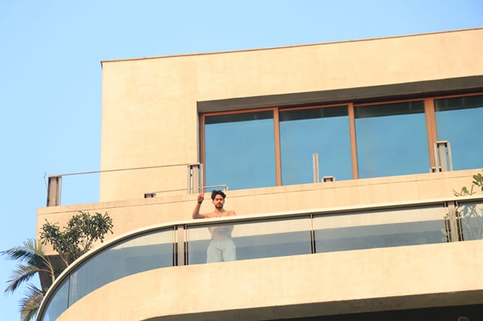 Tiger Shroff posed shirtless in his balcony for the shutterbugs.