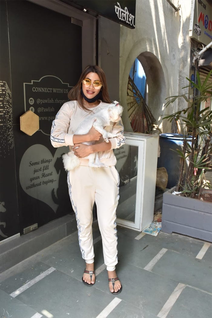 Another former Bigg Boss contestant Nikki Tamboli was photographed with her pet dog outside a clinic in Andheri.