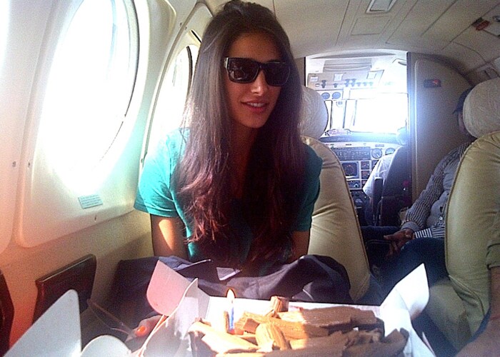 Nargis Fakhri turned 32 in rocking style and there was a birthday surprise for her up in the air.

At twenty-thousand feet, while the film's cast and crew were flying off for a promotional event, the <i>Rockstar</i> debutante was in her seat when one of her staff members took her outside the cabin on some pretext.<br><br/>

When she got back, the entire team yelled "Surprise", and presented the cake to her.<br><br/>

The team sang "Happy Birthday" for her, while an overwhelmed and emotional Nargis cut the cake.<br><br/>

The debutante, who turned 32 on Thursday, fed the cake to Ranbir and others. All of them partied on board the flight.