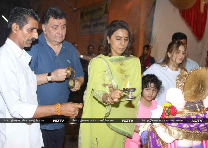 Little Samara watched as grandmother Neetu performed the <i>aarti</i>.