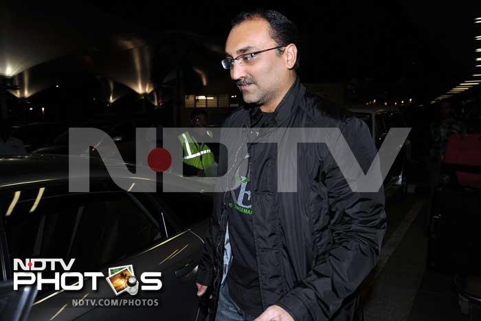 Aditya Chopra leaves the airport.