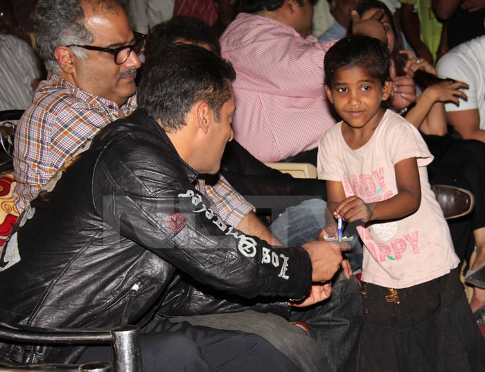 Salman obliges a young fan.