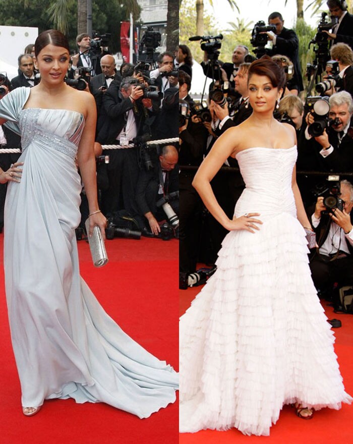 India's ambassador at Cannes - Aishwarya Rai Bachchan on Day 1 looked drop dead gorgeous gliding down the red carpet in a strapless white Roberto Cavalli gown. According to reports the gown was worth Rs 5 million.<br><br>On Day 2 she was seen in a steel grey Off shoulder gown. (Photo: AFP)