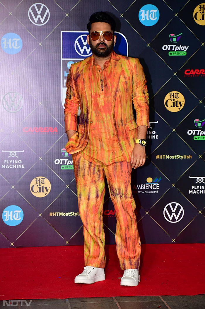 Kapil Sharma put his best fashion foot forward in an orange attire. (Image Courtesy: Varinder Chawla)