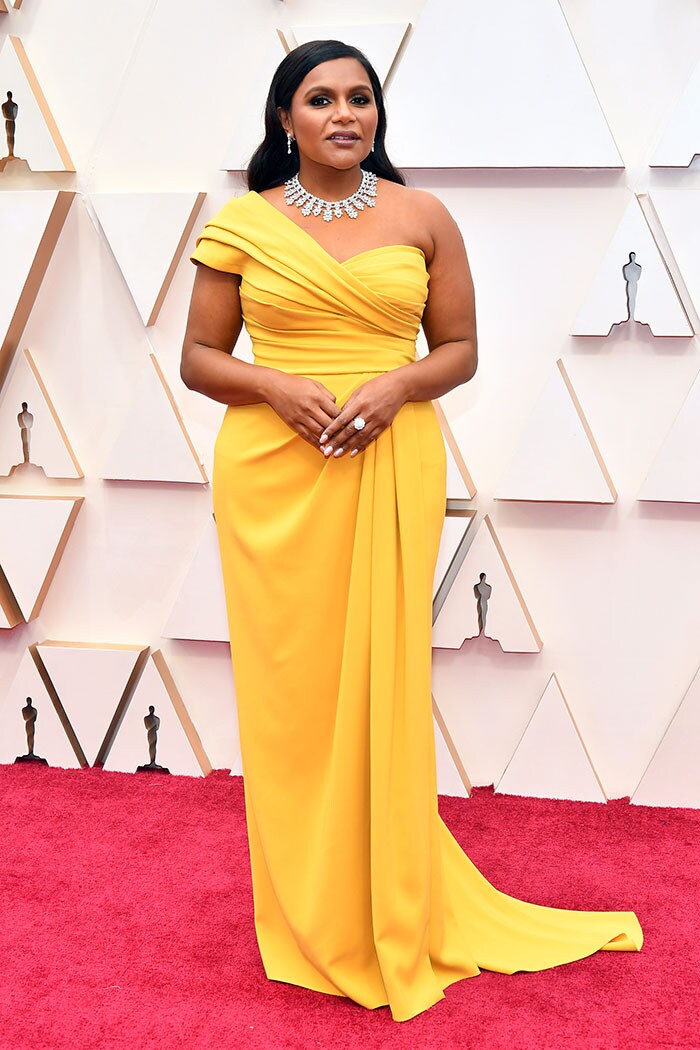 Actress Mindy Kaling wore a yellow ensemble by Dolce & Gabbana.