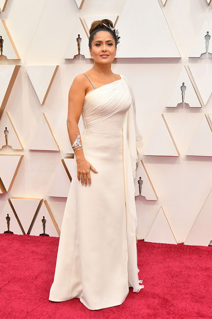 <I>Frida</I> actress Salma Hayek looked ravishing in an all-white Gucci dress.