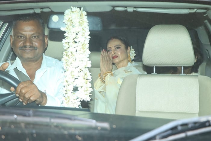 Rekha looked stunning as ever in a white <i>saree</i> during the film's screening.