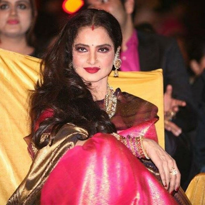 At 62, Rekha might no longer believe in celebrating birthdays as she has reportedly said. However, ever since this Southern beauty entered Bollywood, she has lost none of the mystique and glamour that have made her a figure of national fascination over her many years in the industry. We celebrate her birthday with a journey through her life and times.<br><br>

This image was posted on Instagram by <a href="https://www.instagram.com/bollywood.q80/" target="_blank" rel="nofollow" >bollywood.q80</a>