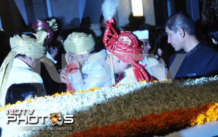 Genelia surrounded by her family at a tender moment as Riteish looks on.