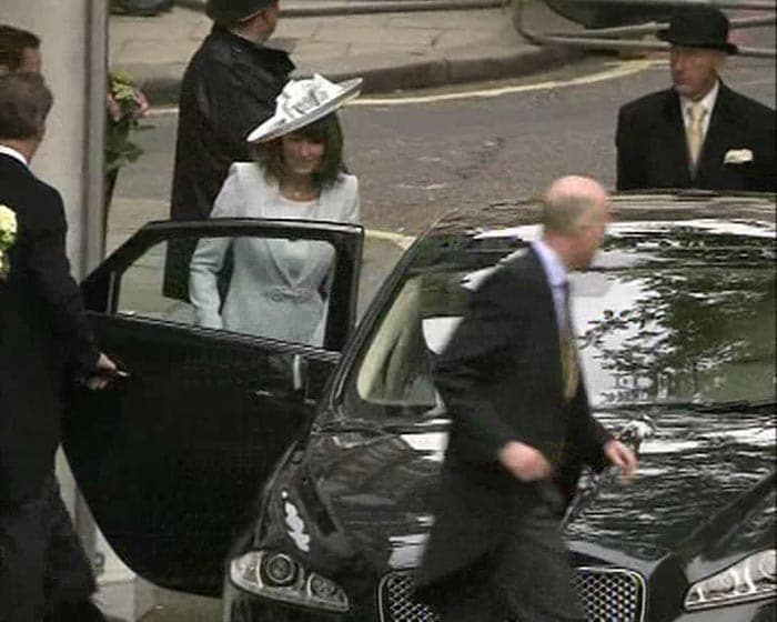 Kate's mother arrives in a sky blue crepe wool coat dress by Catherine Walker, who was Princess Di's favourite designer.