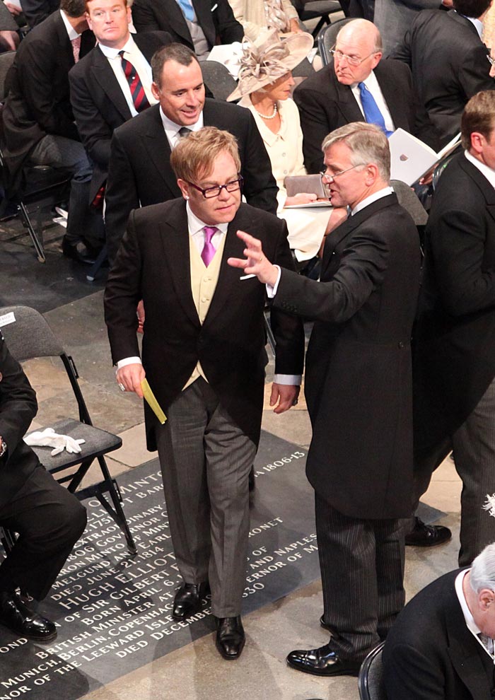 Sir Elton John makes his way to his seat.